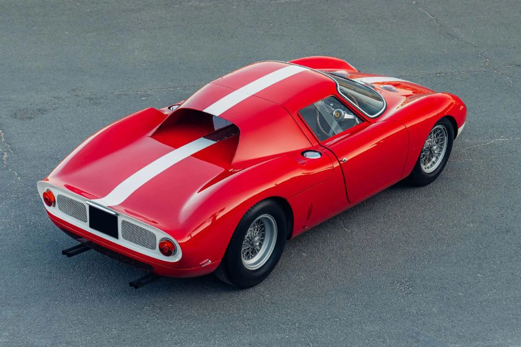 This is a 1964 Ferrari 250 LM in red with white racing stripe. 