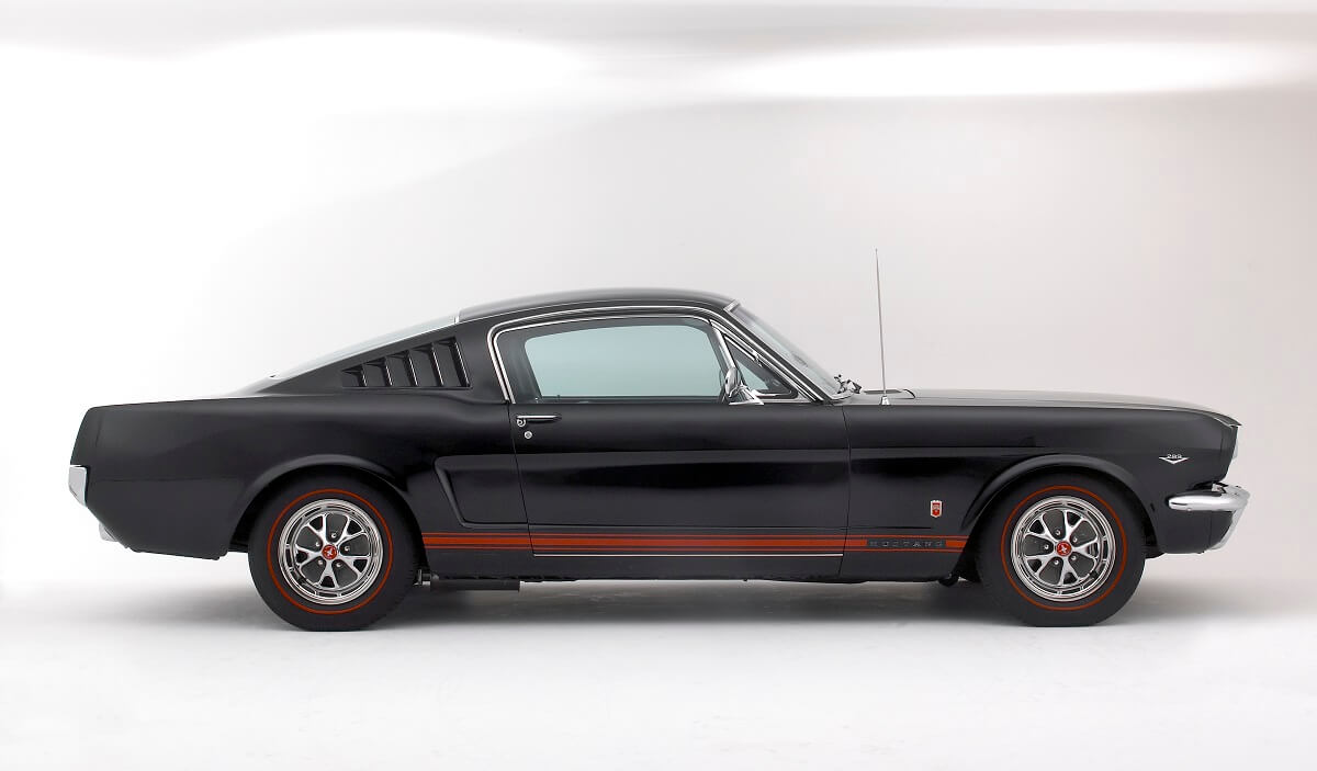 A black and red 1966 Ford Mustang 289 shows off its fastback construction.