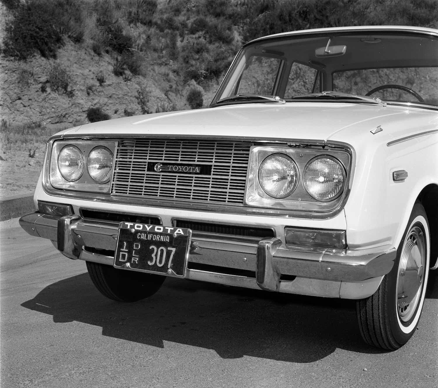 The Toyota logo in the grille of a 1966 Corona sedan.
