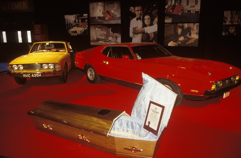A 1971 Ford Mustang Mach 1, one of the cars without an Aston Martin badge in the franchise, shows off in a James Bond car exhibit.
