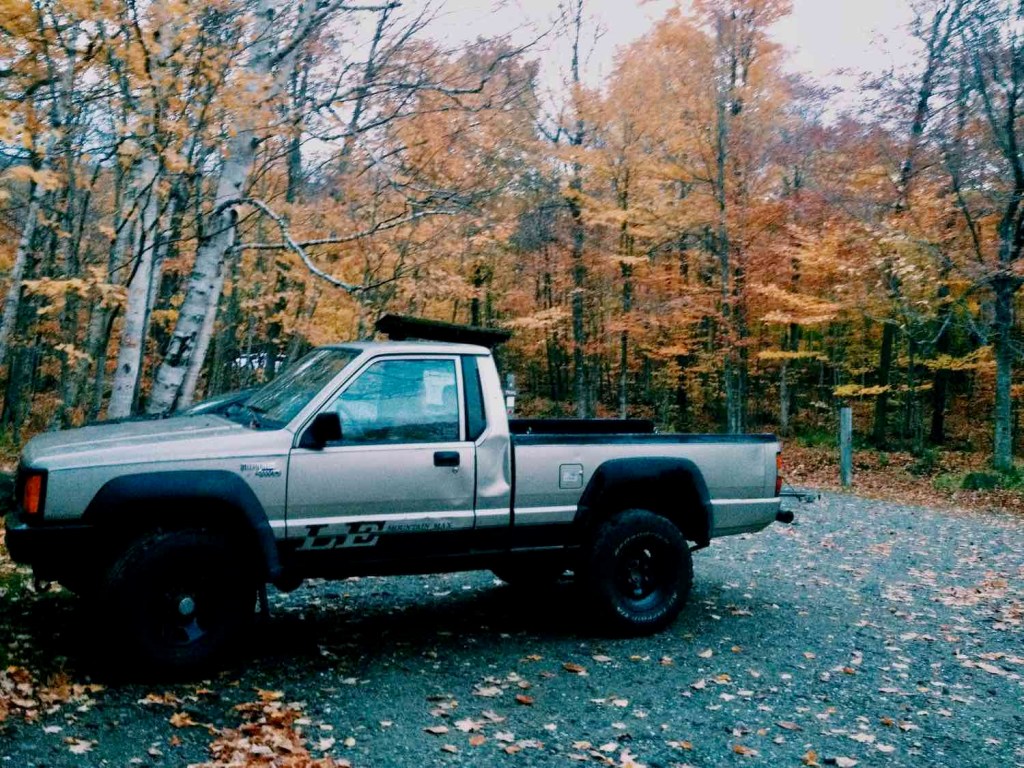 A tan Mitsubishi "Mountain Max" 4WD trim of the compact "Mighty Max" pickup truck