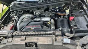 The engine bay of a 2004 Ford Super Duty with a 6.0-liter Power Stroke V8 engine.