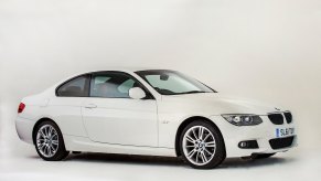 A 2011 BMW 3 Series in white on display against a white background. The 2011 BMW complaints get kind of weird.