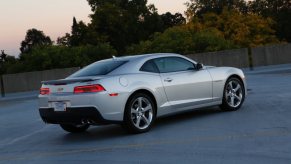 A silver 2014 Chevrolet Camaro shows off its rear-end styling.
