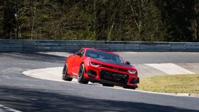 A bright red Chevrolet Camaro ZL1 1LE takes on the storied Nürburgring.