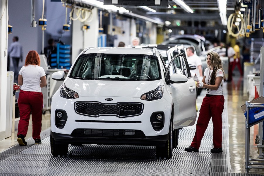 The 2018 Kia Sportage in white being assembled at the factory. The 2018 Sportage is a premier used compact SUV.