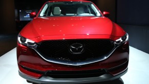 A red 2018 Mazda CX-5, the Ford Escape's competition, at the Brussels Motor Show