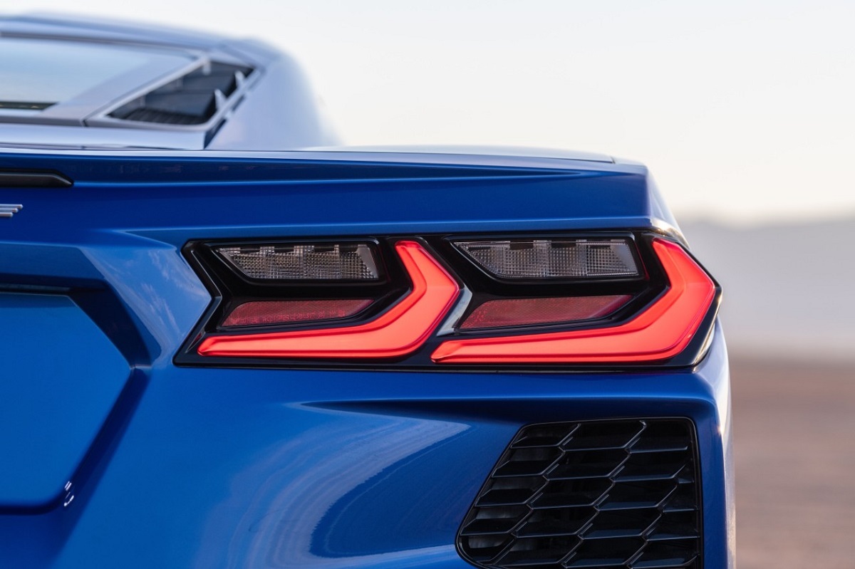 A blue Chevrolet Corvette shows off its rear-end lighting.