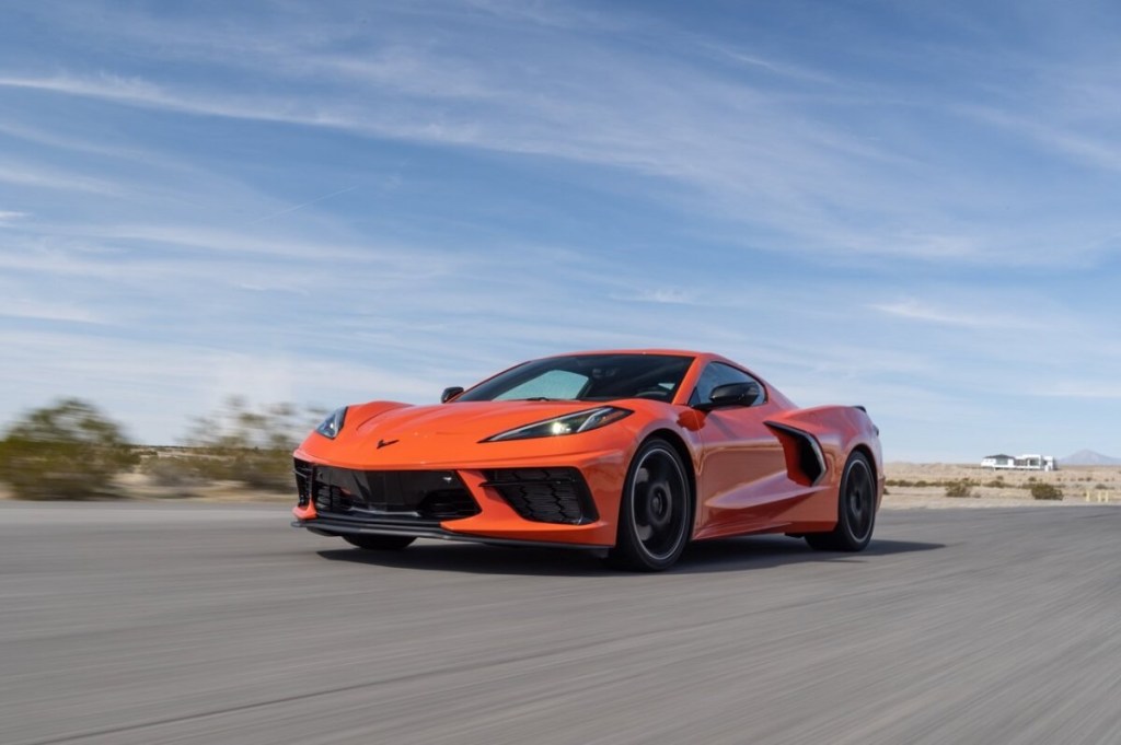 An orange 2023 Chevrolet Corvette Stingray Z51 Coupe blasts down a desert road.