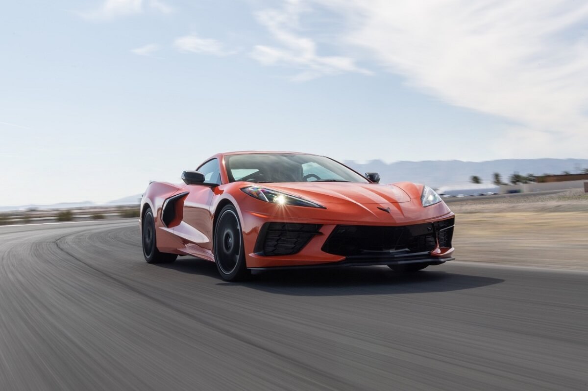 A 2023 Chevrolet Corvette C8 Stingray shows off its handling by taking a corner on a track.
