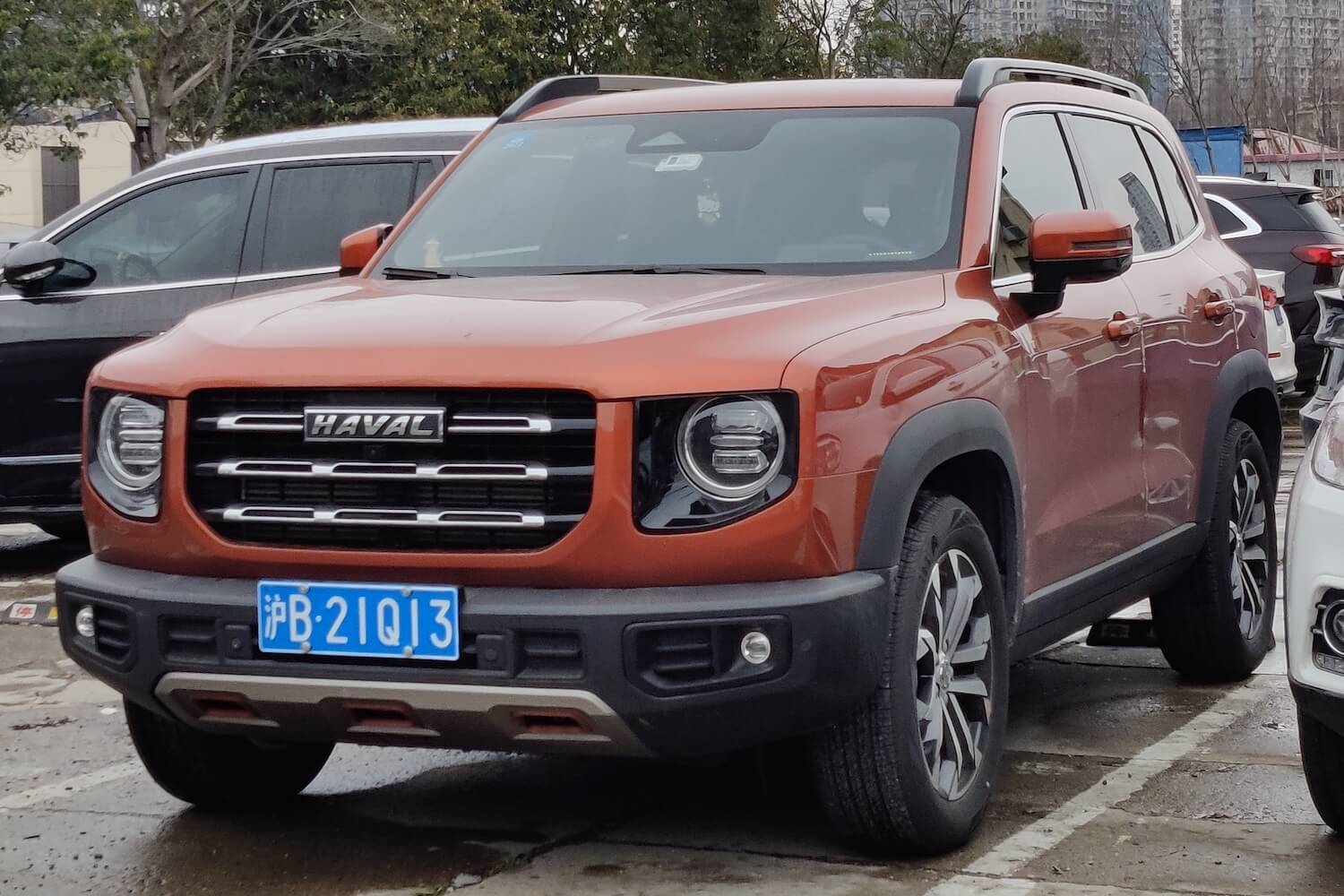 An orange "Big Dog/Dargo" Crossover SUV made by Haval