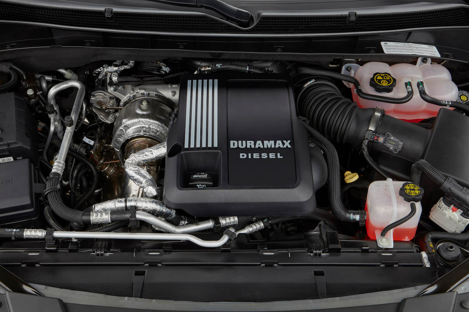 The Duramax 3.0-liter I6 diesel engine under the hood of a 2021 Cadillac Escalade SUV