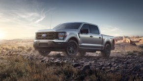 A silver 2023 Ford F-150 Rattler at dusk on a desert road. Ford F-150 owners love many things about their truck