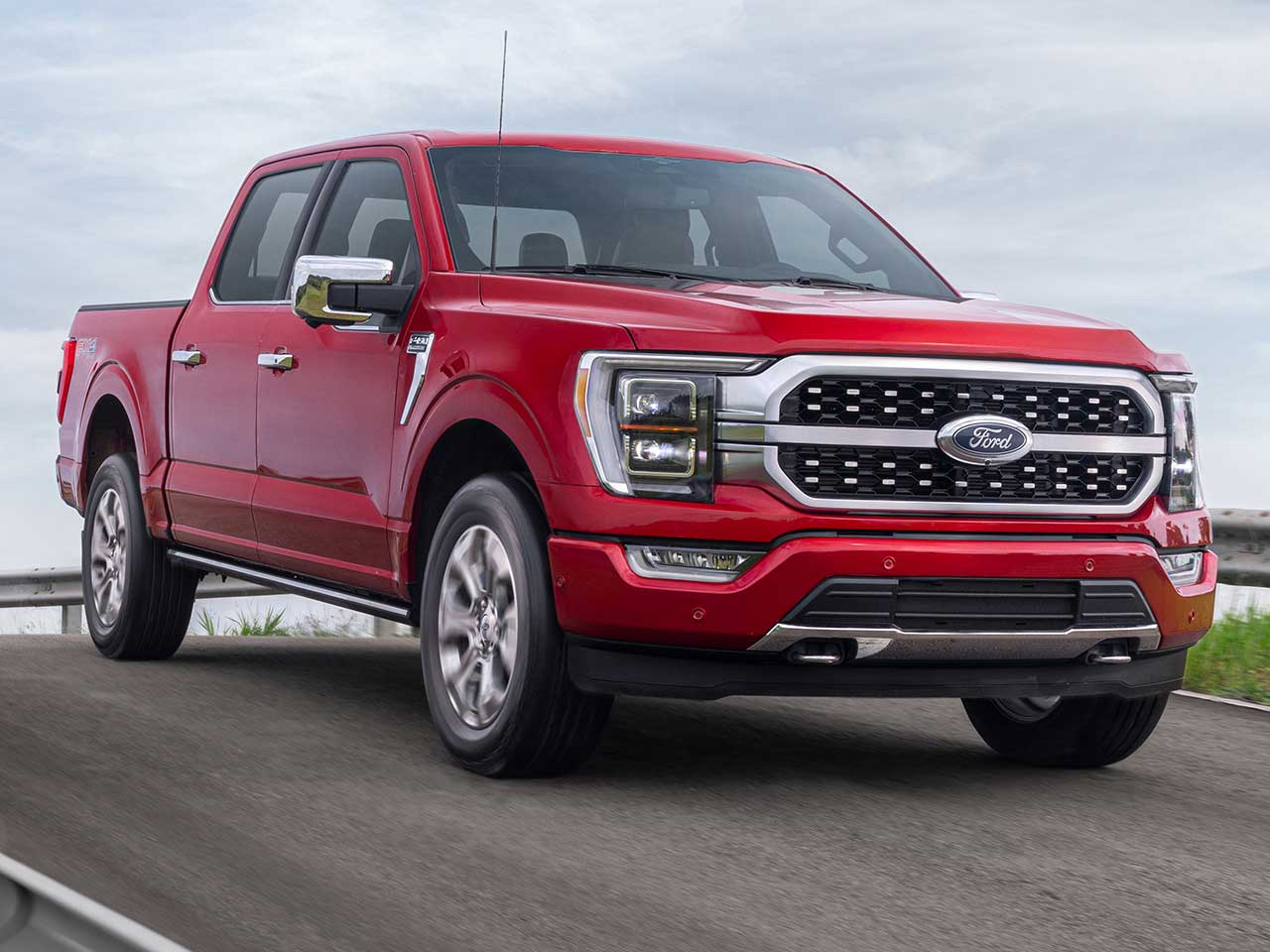 The 2023 Ford F-150 driving down the road with BlueCruise