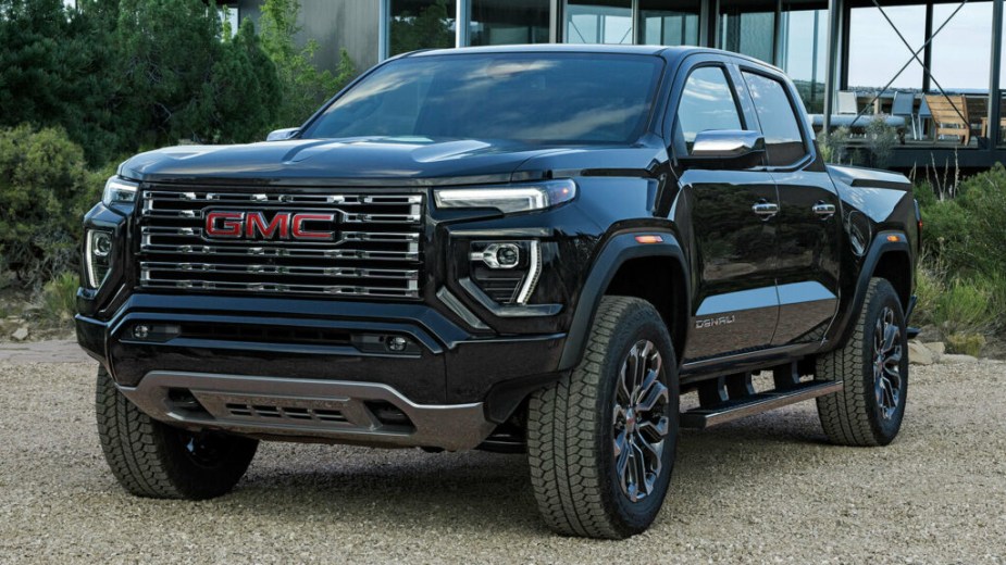 The 2023 GMC Canyon parked near a home