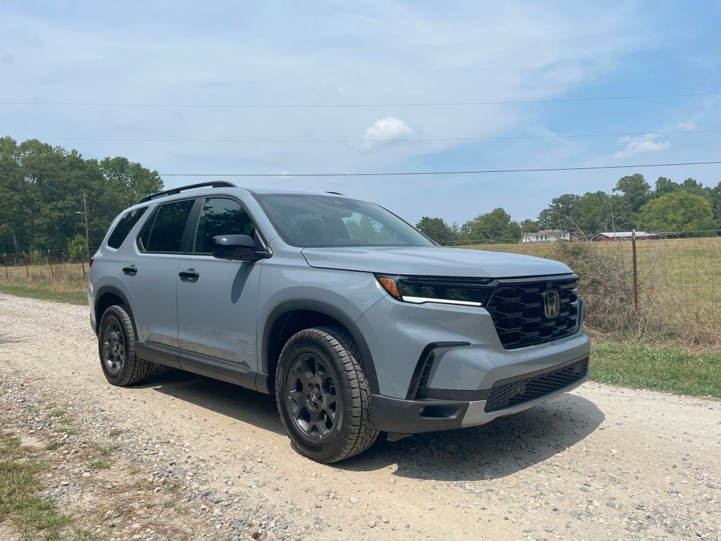 The 2023 Honda Pilot TrailSport on a dirt road