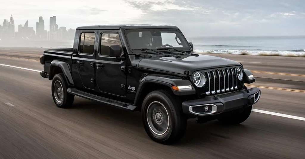 A black 2023 Jeep Gladiator driving down the highway