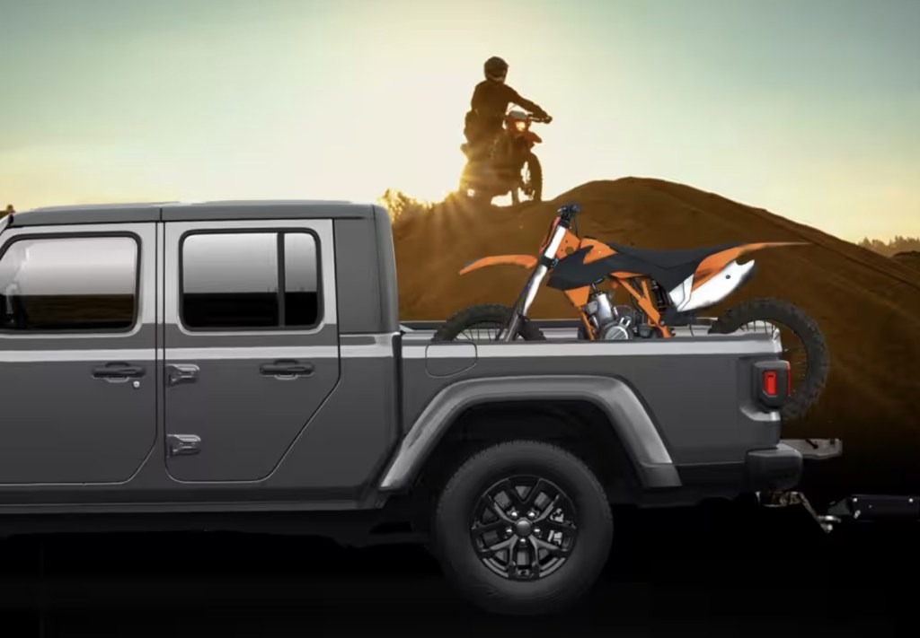 A Jeep Gladiator truck bed with a dirt bike 