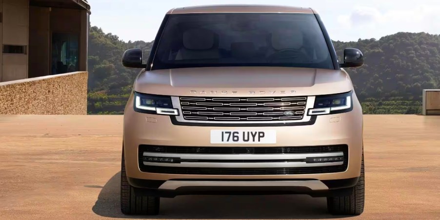 A gray 2023 Land Rover Range Rover luxury midsize SUV is parked.