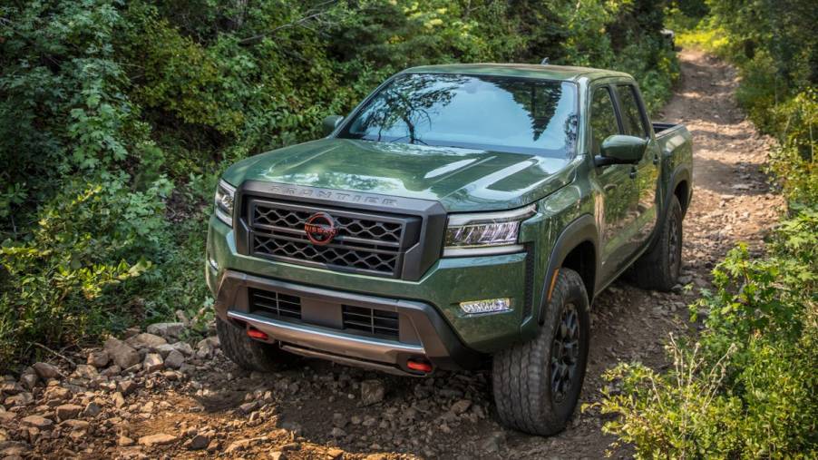 The 2023 Nissan Frontier off-roading in the woods