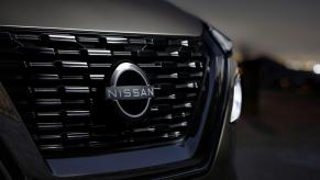 A closeup shot of the grille and headlight design on a 2023 Nissan Rogue compact SUV model