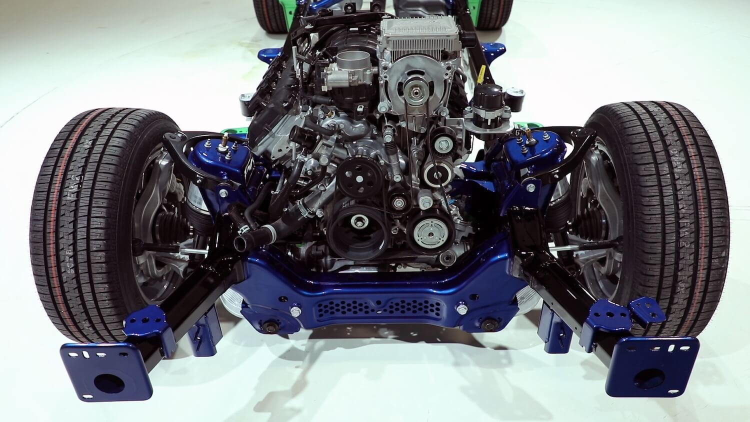 The exposed 5.7-liter Hemi engine in a Ram 1500 pickup truck chassis