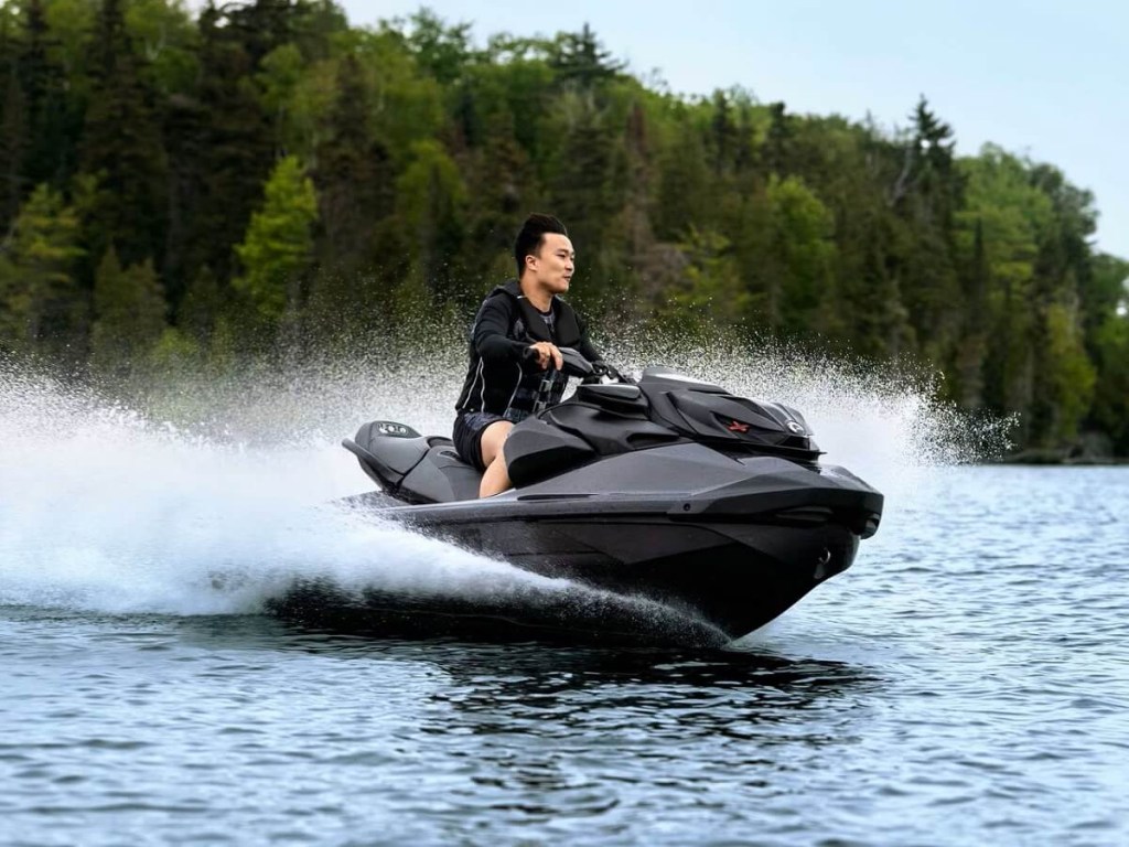 A Sea-Doo RXP-X 300 jet ski, a rival to the Yamaha GP1800R SVHO, shows how its one of the fastest on the market by kick up water.