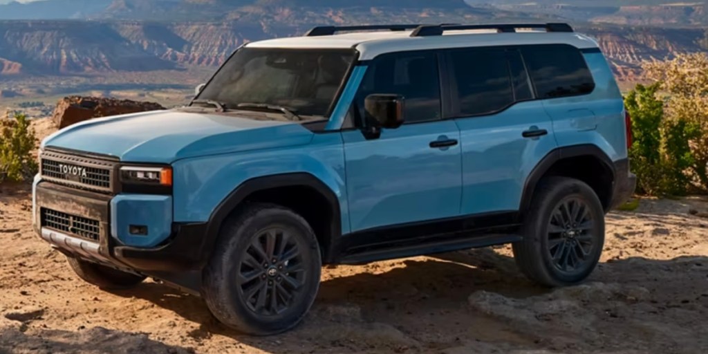 A blue 2024 Toyota LC midsize SUV is parked outdoors.