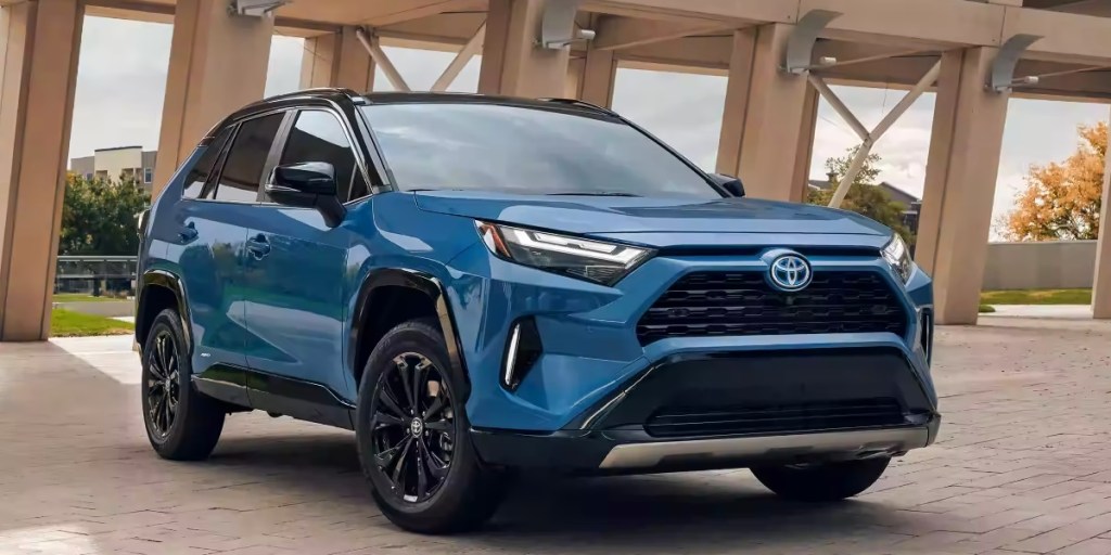 A blue 2023 Toyota RAV4 Hybrid small hybrid SUV is parked.