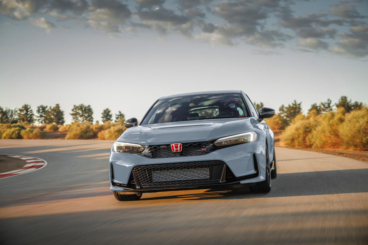 The Type R version of the Civic in gray on a track. Some 2023 Honda Civic trims are more popular than others.