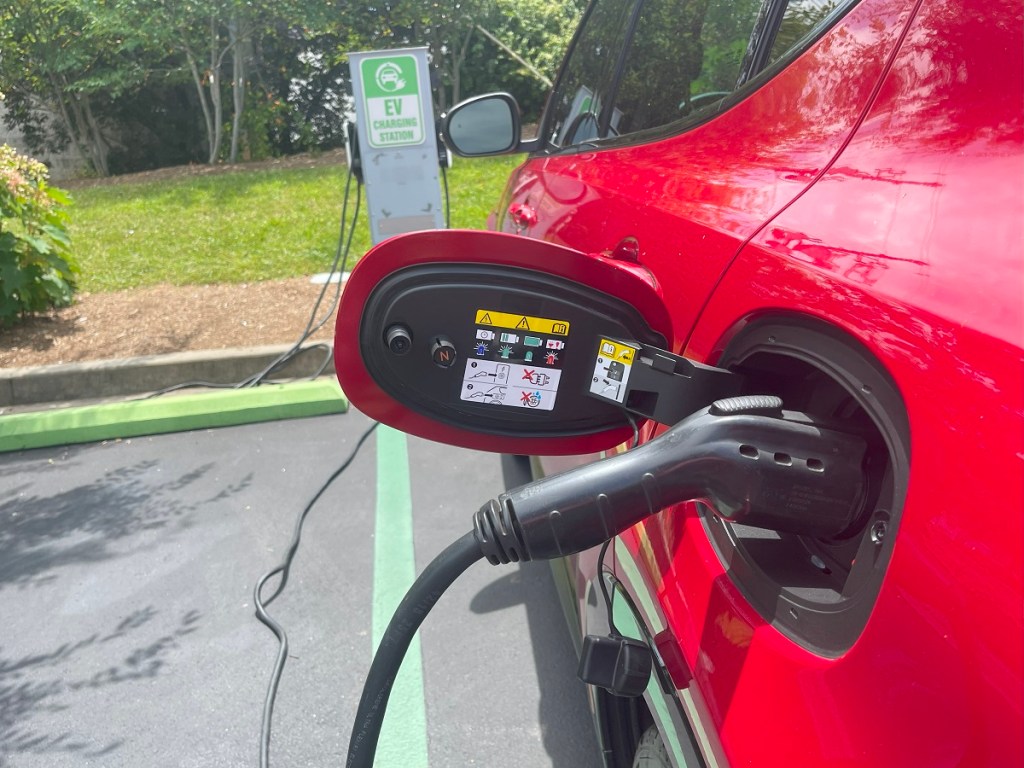 The 2024 Alfa Romeo Tonale charging at an EV charging station