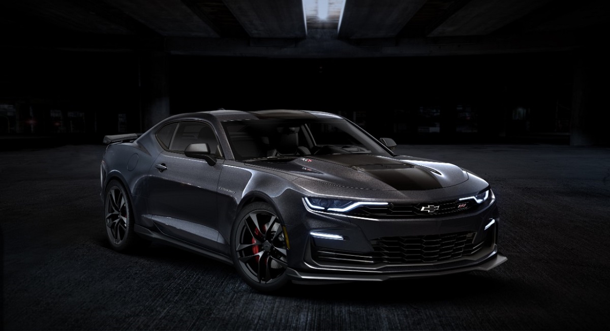 A 2024 Chevrolet Camaro SS shows off its dark aesthetic and prominent splitter.