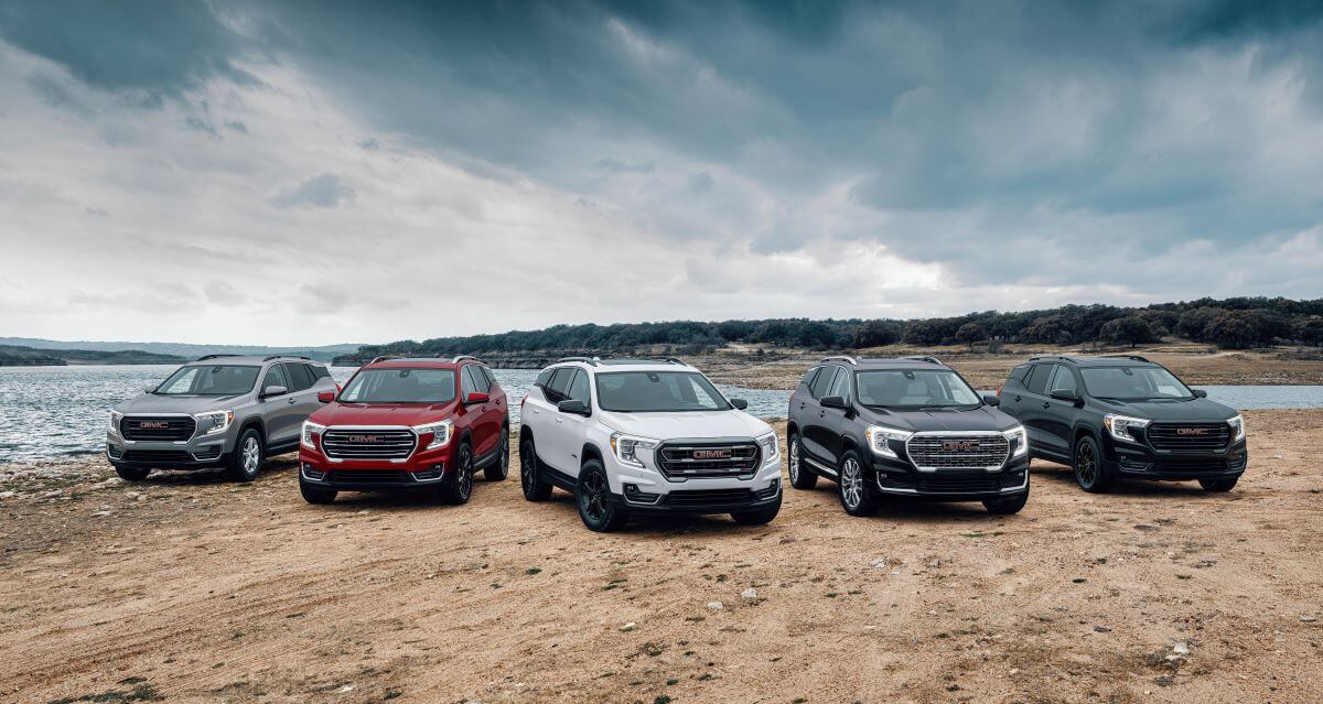The 2024 GMC Terrain (L to R) SLE, SLT, AT4, Denali, and Elevation Edition trim level models