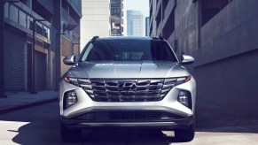 A gray 2024 Hyundai Tucson small SUV is parked.