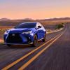 A 2024 Lexus NX 450h compact luxury SUV model driving down a desert highway road