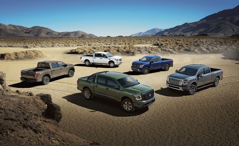 2024 Nissan truck lineup parked in the desert.