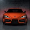 An orange 2024 Manual Toyota Supra 3.0 shows off its front-end styling.