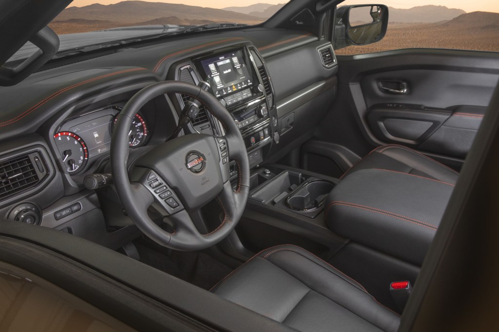 The 2024 Nissan Titan interior and dash from the driver's side