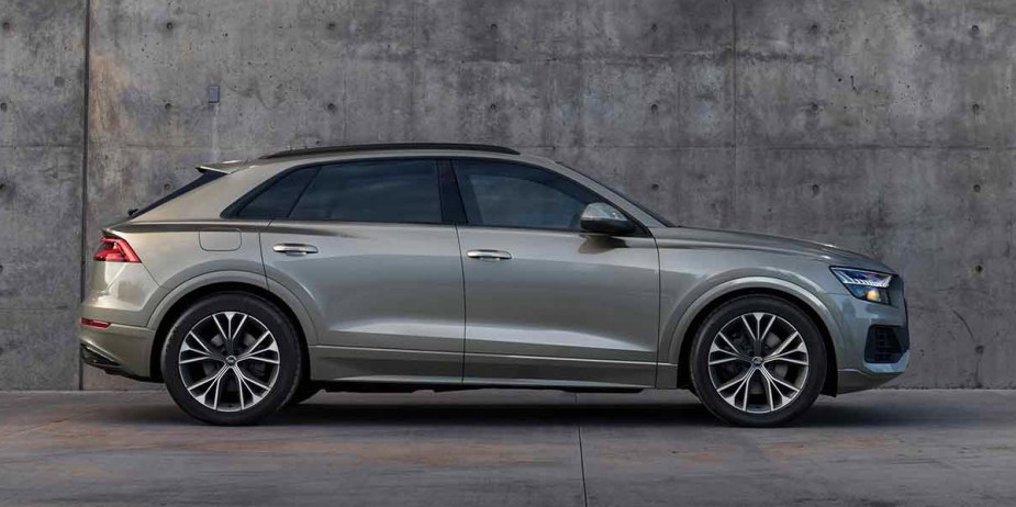 A gray Audi Q8 midsize SUV is parked. 