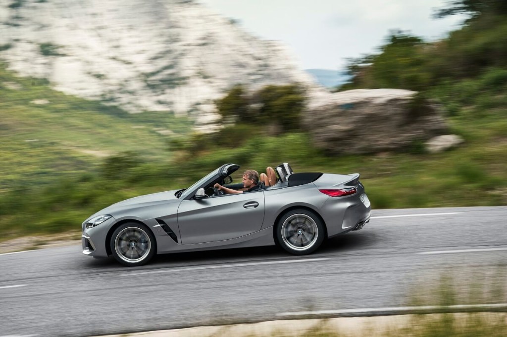 A gray 2023 BMW Z4 M40i drives on country roads.