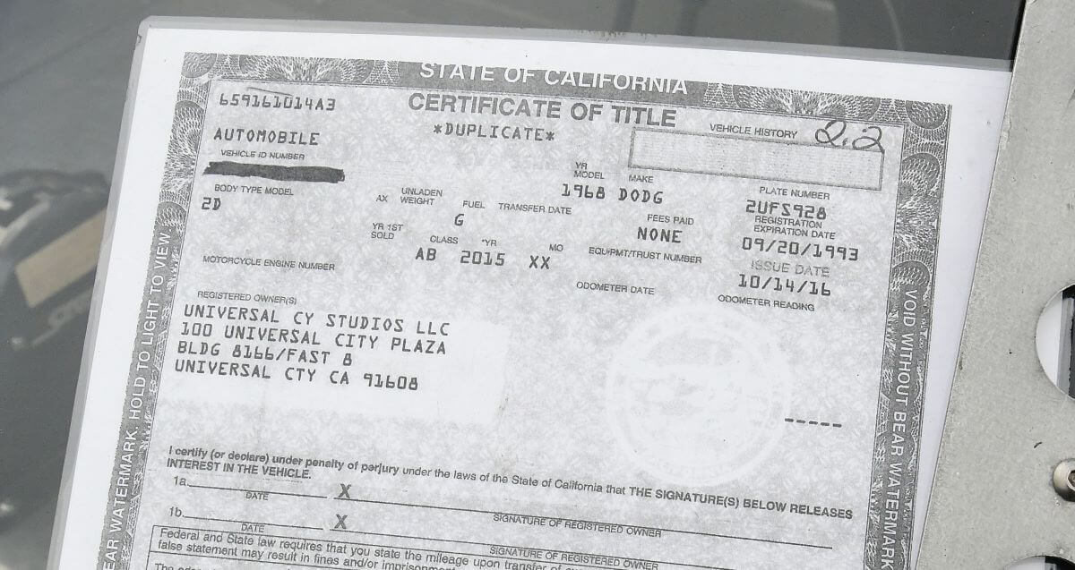 A State of California car title certificate for 'Fast & Furious 8' on display at FuelFest