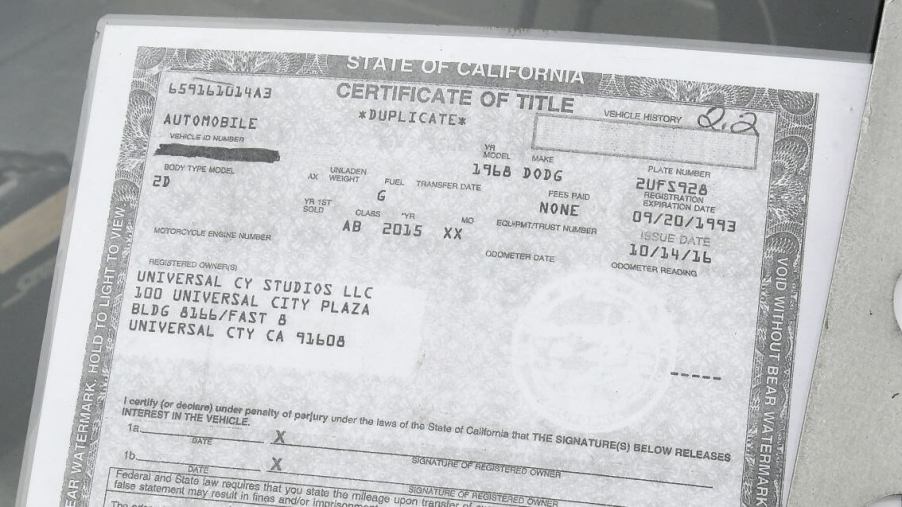 A State of California car title certificate for 'Fast & Furious 8' on display at FuelFest