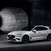 The cheapest new Genesis – Genesis G70 – in white on display in a tunnel.