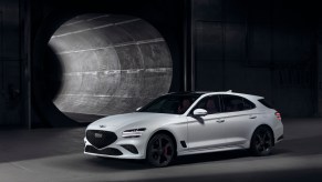 The cheapest new Genesis – Genesis G70 – in white on display in a tunnel.