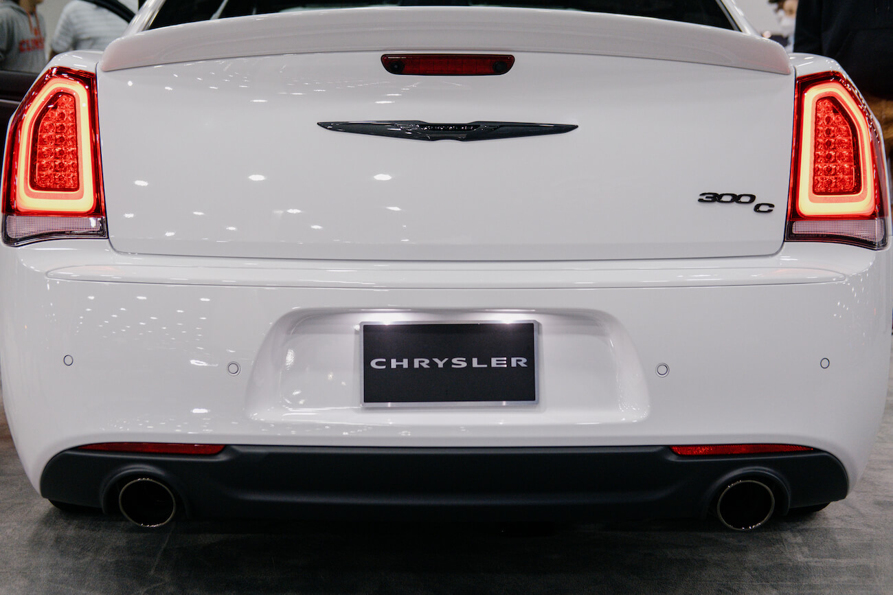 The rear of a white Chrysler 300. Chrysler 300 sales are lagging as the model dies out.