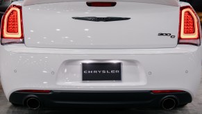 The rear of a white Chrysler 300. Chrysler 300 sales are lagging as the model dies out.