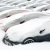 Cars for sale buried in snow in the winter
