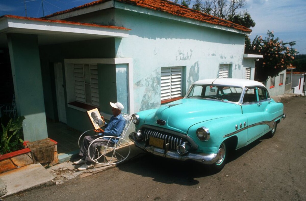 Old Buick next to house