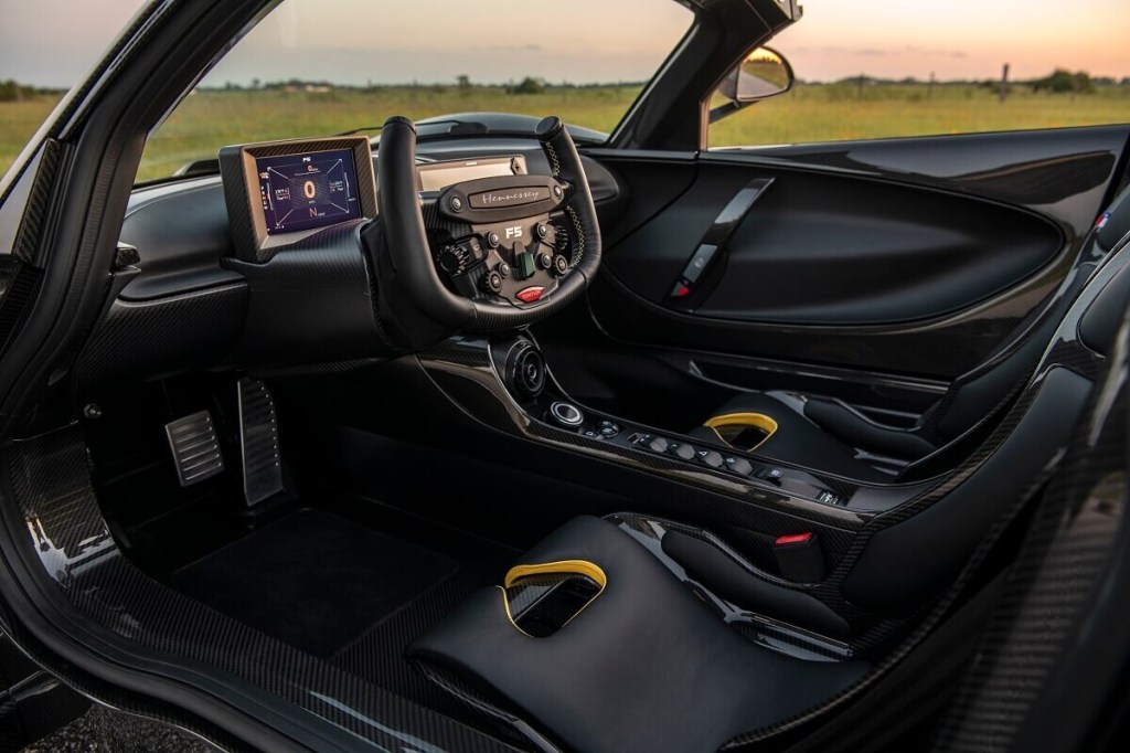 A interior in the Revolution Roadster shows its racing-derived features.