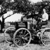 Henry Ford sitting on an early Ford automobile with the Model B engine in 1904